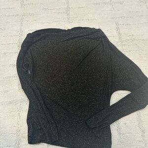 Elan gold shimmer top with a slanted off the shoulder neckline.